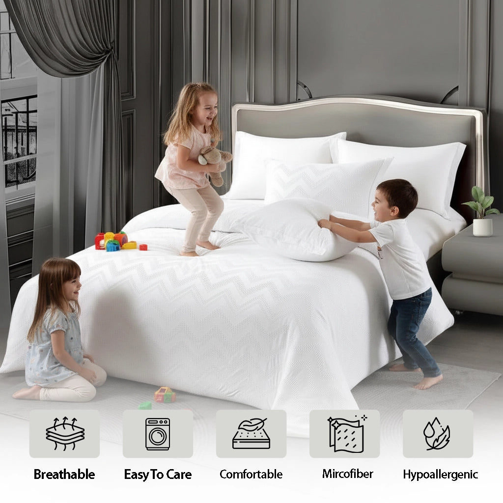 Textured white duvet set  folded neatly over fitted bed sheet set