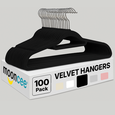 Box of black velvet hangers with 'moonceee' branding on a gray background