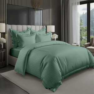 Green striped duvet cover set styled on a neatly made bed