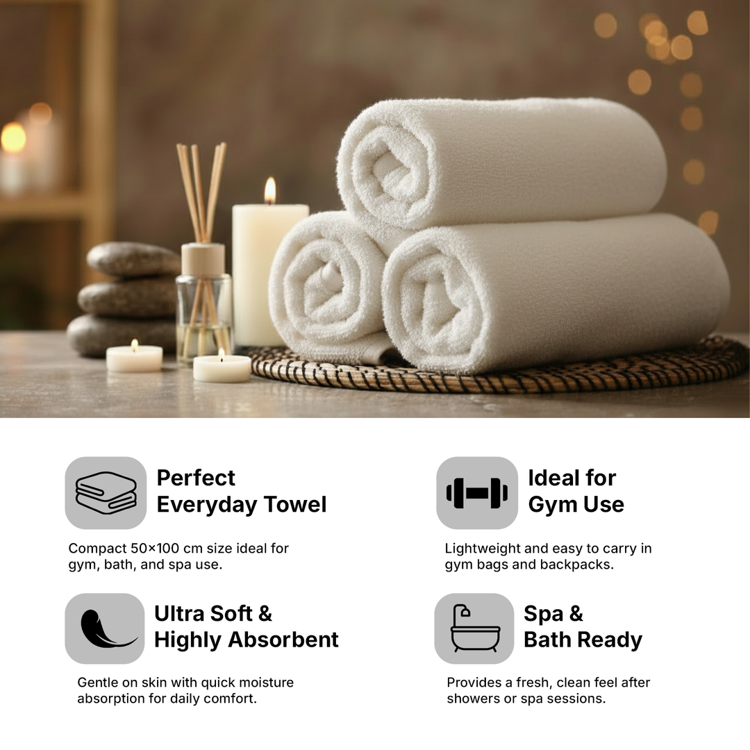 Spa towels on a wooden surface with candles and diffuser, labeled for everyday use, gym, and spa.
