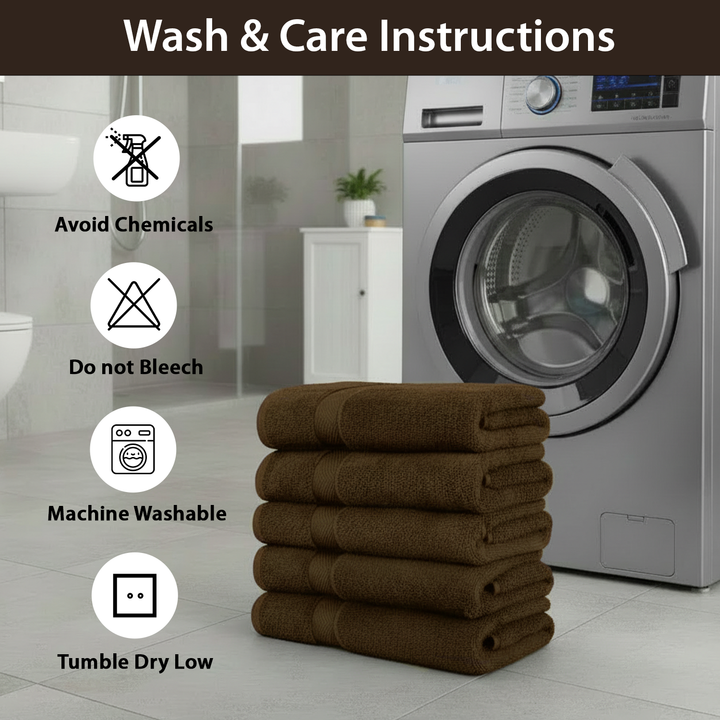 Brown towels stacked in front of a washing machine with wash care instructions