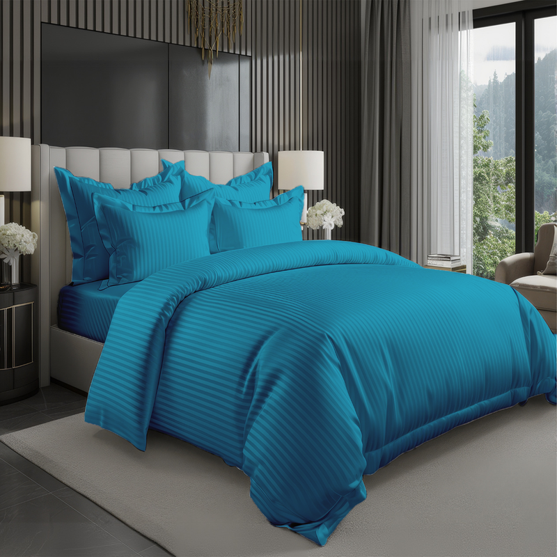 Teal hotel style bedding set with satin stripe duvet cover and pillow covers on bed