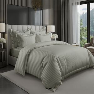 Sage green striped duvet cover with fitted sheet and matching pillowcases on bed