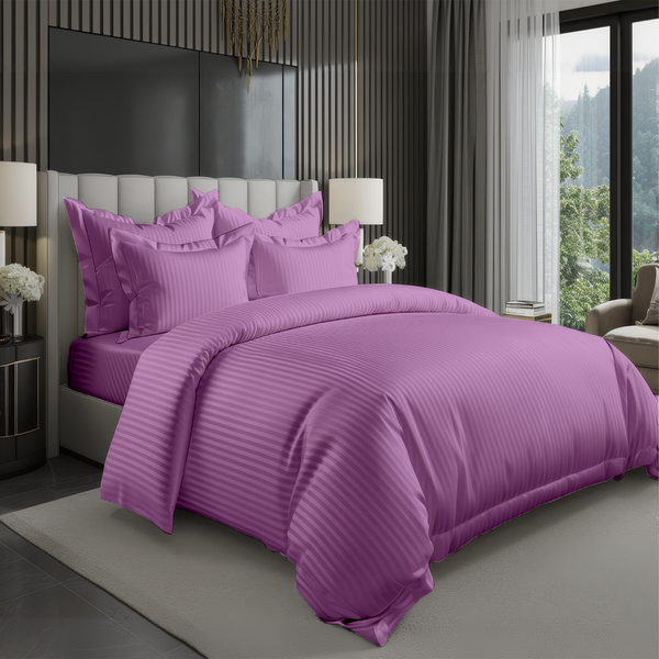 Purple striped bedsheet set with matching pillow covers on a modern bed