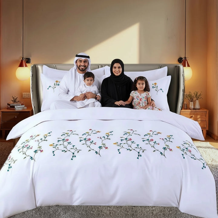 Close view of white duvet cover with multicolor floral embroidery detail