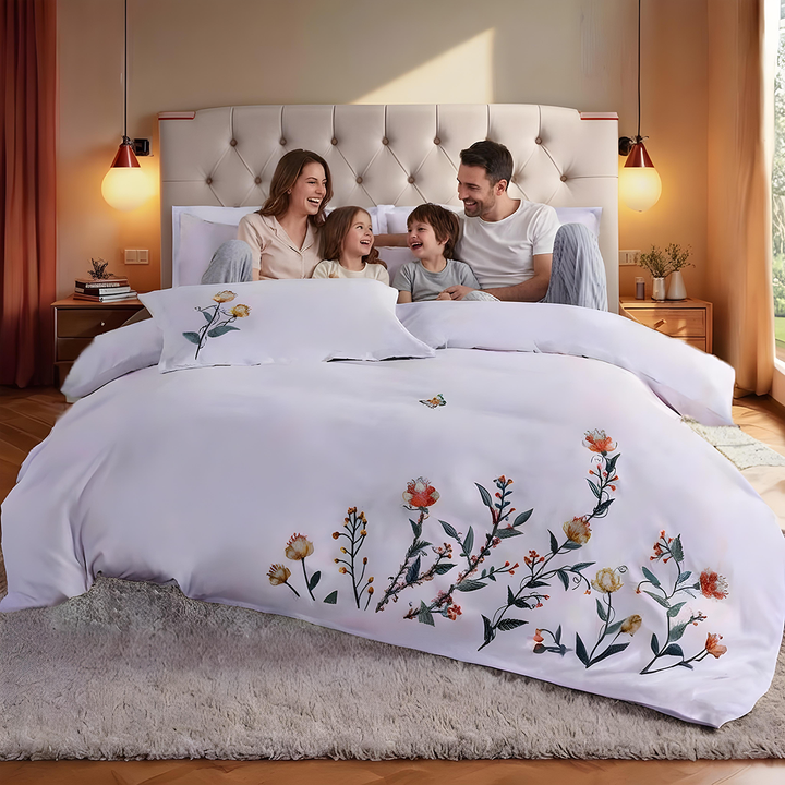 White floral bedding arrangement including bed sheet, quilt cover, and pillow cover